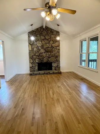 a view of a livingroom with wooden floor