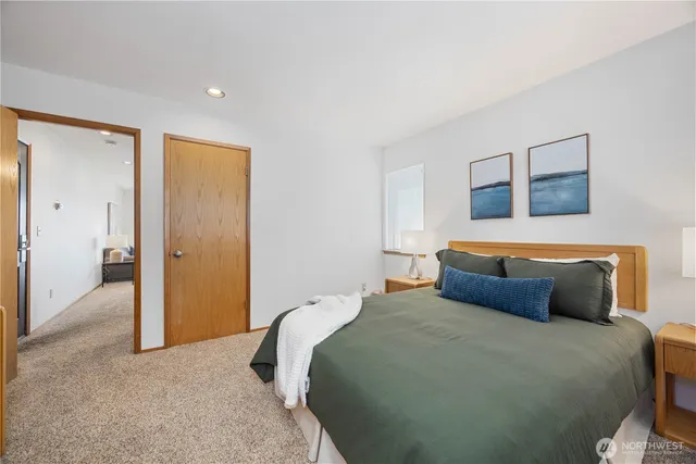 a bedroom with a bed and hallway