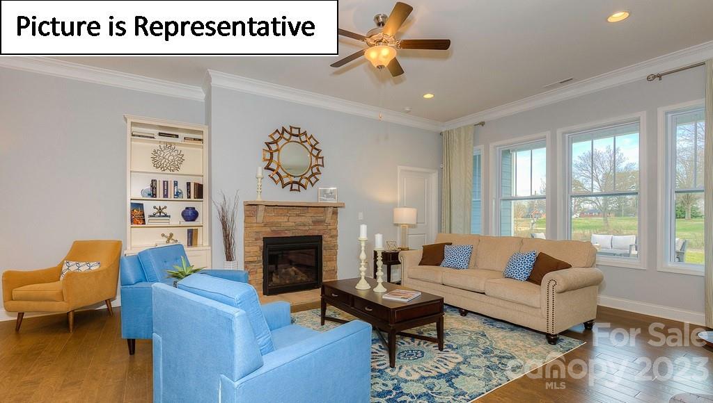 4190 Millstream Road Denver, NC 28037 - Photo 18 of 33 a living room with furniture and a fireplace