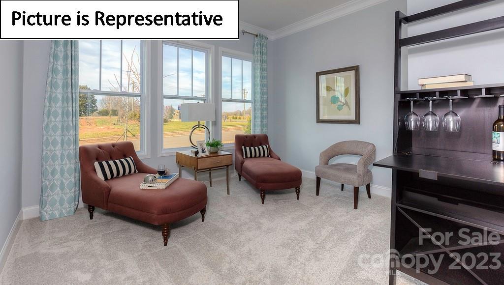 4190 Millstream Road Denver, NC 28037 - Photo 20 of 33 a living room with furniture and a floor to ceiling window