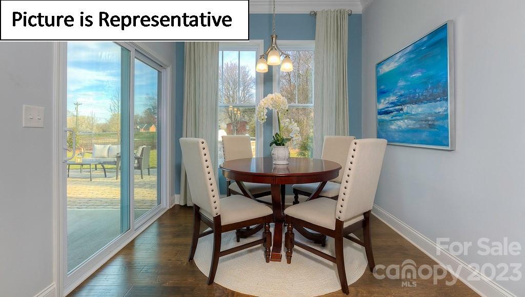 4190 Millstream Road Denver, NC 28037 - Photo 23 of 33 a view of a dining room with furniture window and wooden floor