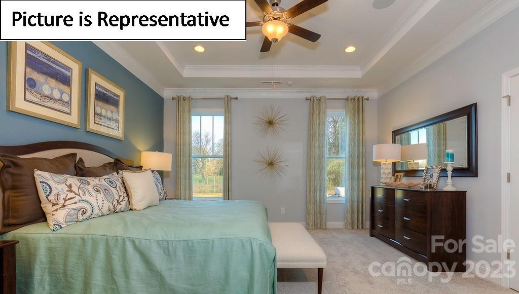 4190 Millstream Road Denver, NC 28037 - Photo 26 of 33 a bedroom with a bed and a mirror