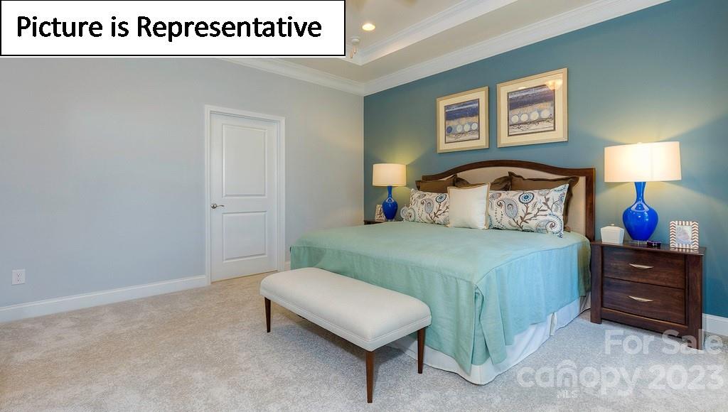 4190 Millstream Road Denver, NC 28037 - Photo 27 of 33 a bedroom with a bed and a lamp on table