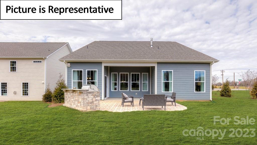 4190 Millstream Road Denver, NC 28037 - Photo 31 of 33 a view of a house with a yard patio and fire pit