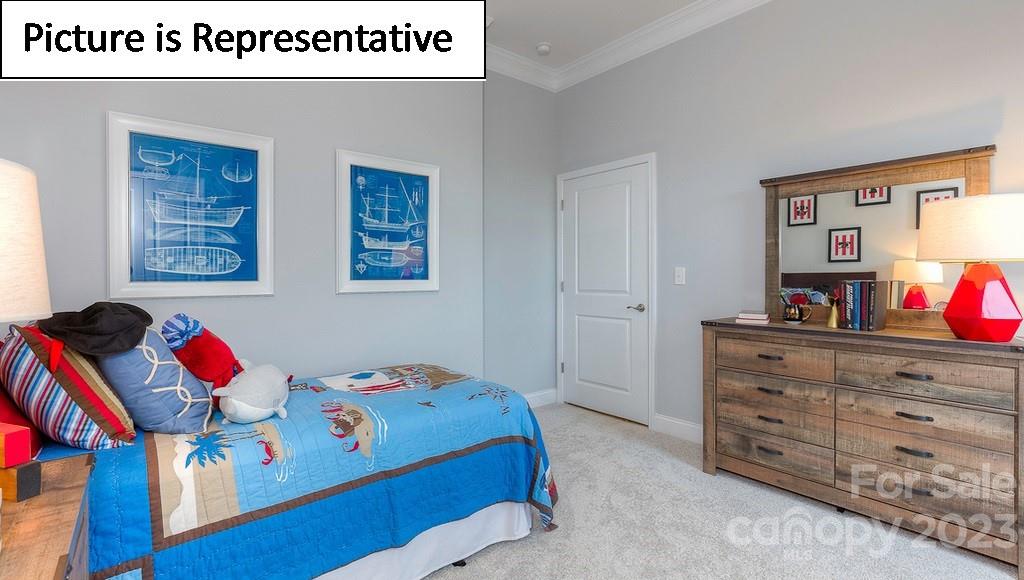 4190 Millstream Road Denver, NC 28037 - Photo 4 of 33 a bedroom with a bed and wooden floor