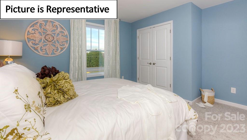 4190 Millstream Road Denver, NC 28037 - Photo 7 of 33 a bed with a bed and a painting on the wall