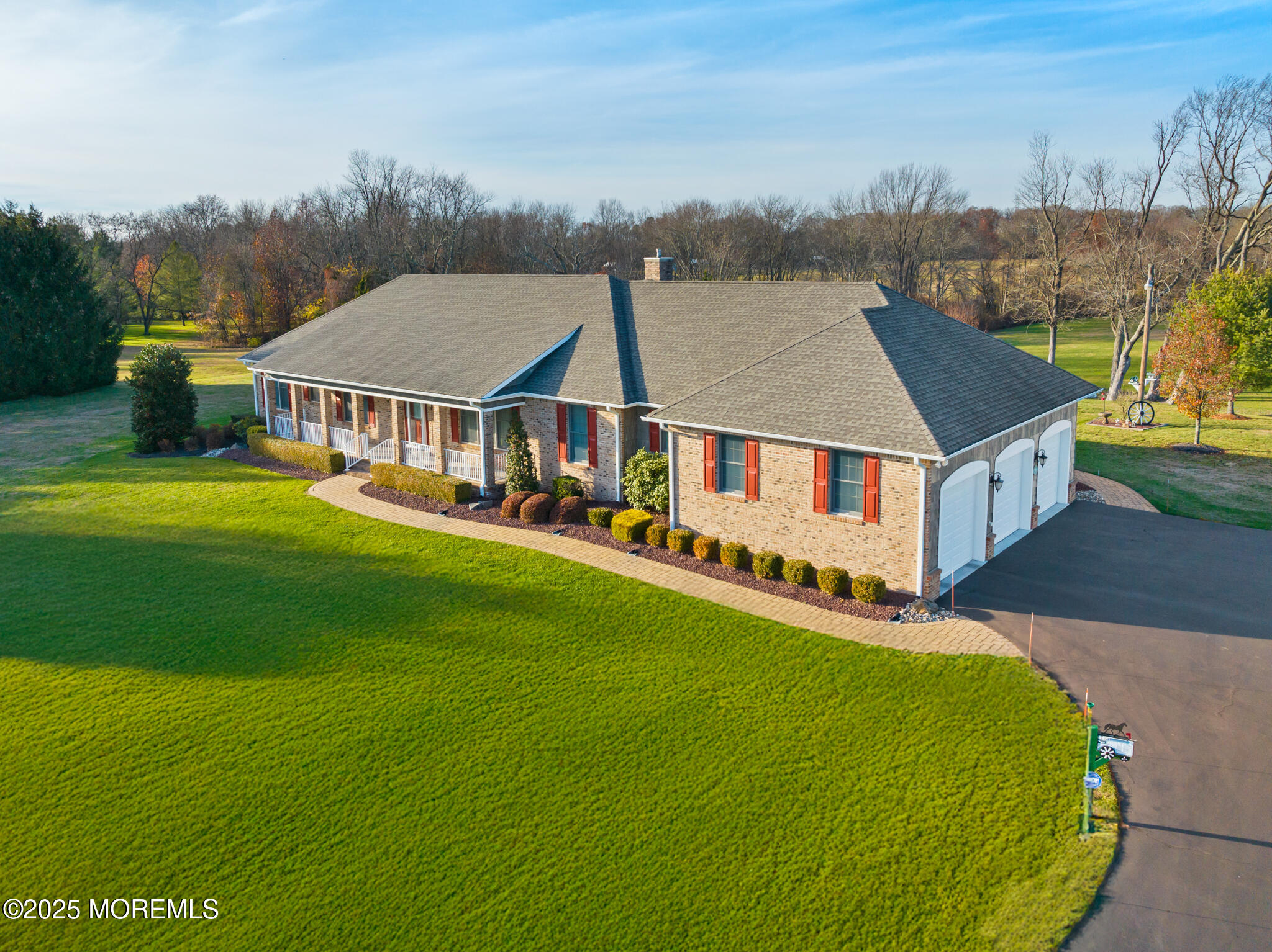 a aerial view of a house with a big yard