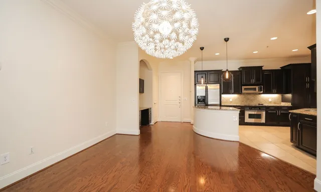 a view of kitchen with kitchen island microwave and stove