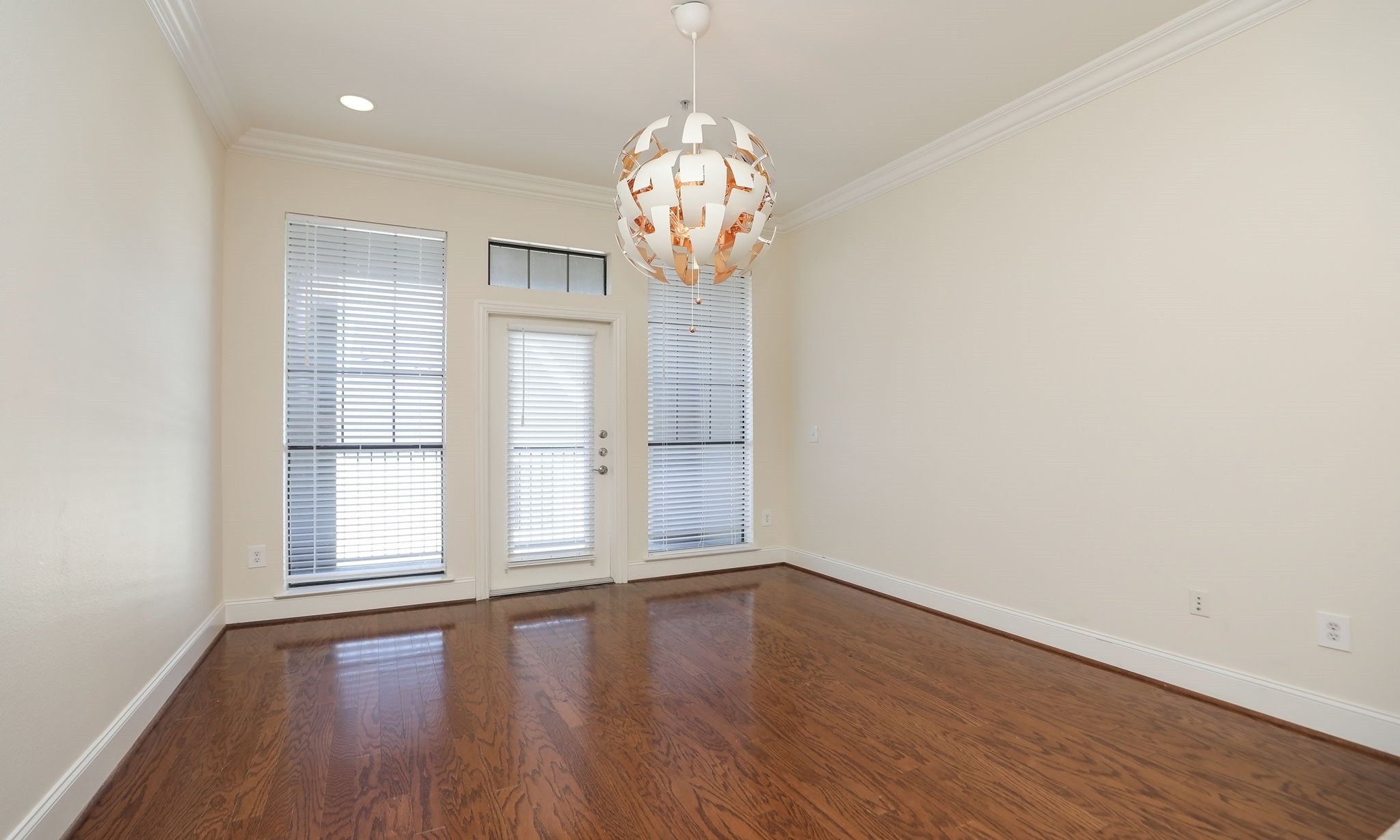 2120 Kipling Street, Unit 402 Houston, TX 77098 - Photo 16 of 30 a view of empty room with wooden floor and fan