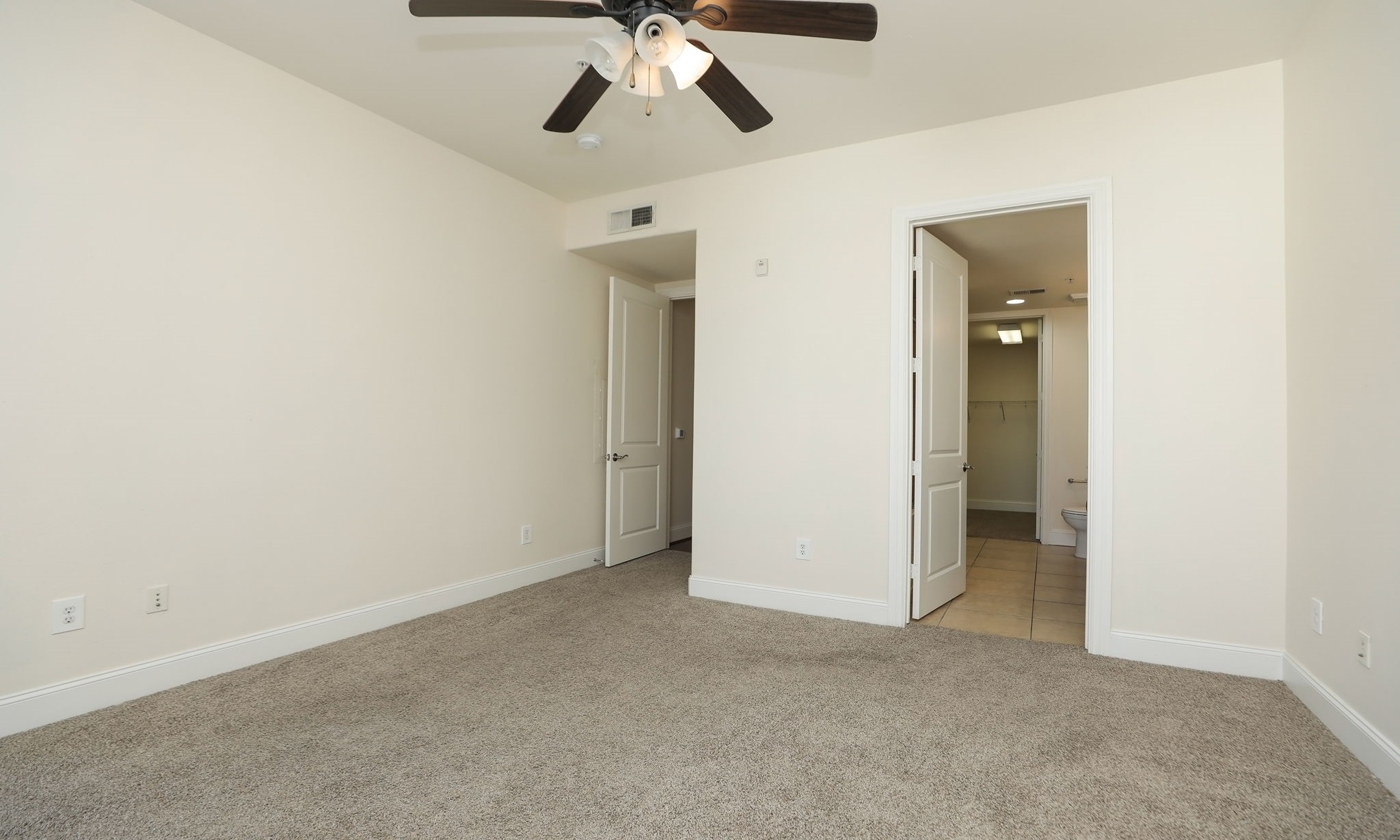 2120 Kipling Street, Unit 402 Houston, TX 77098 - Photo 22 of 30 a view of an empty room and chandelier fan
