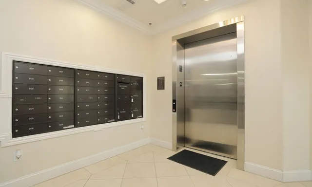 a room with a large mirror and glass door