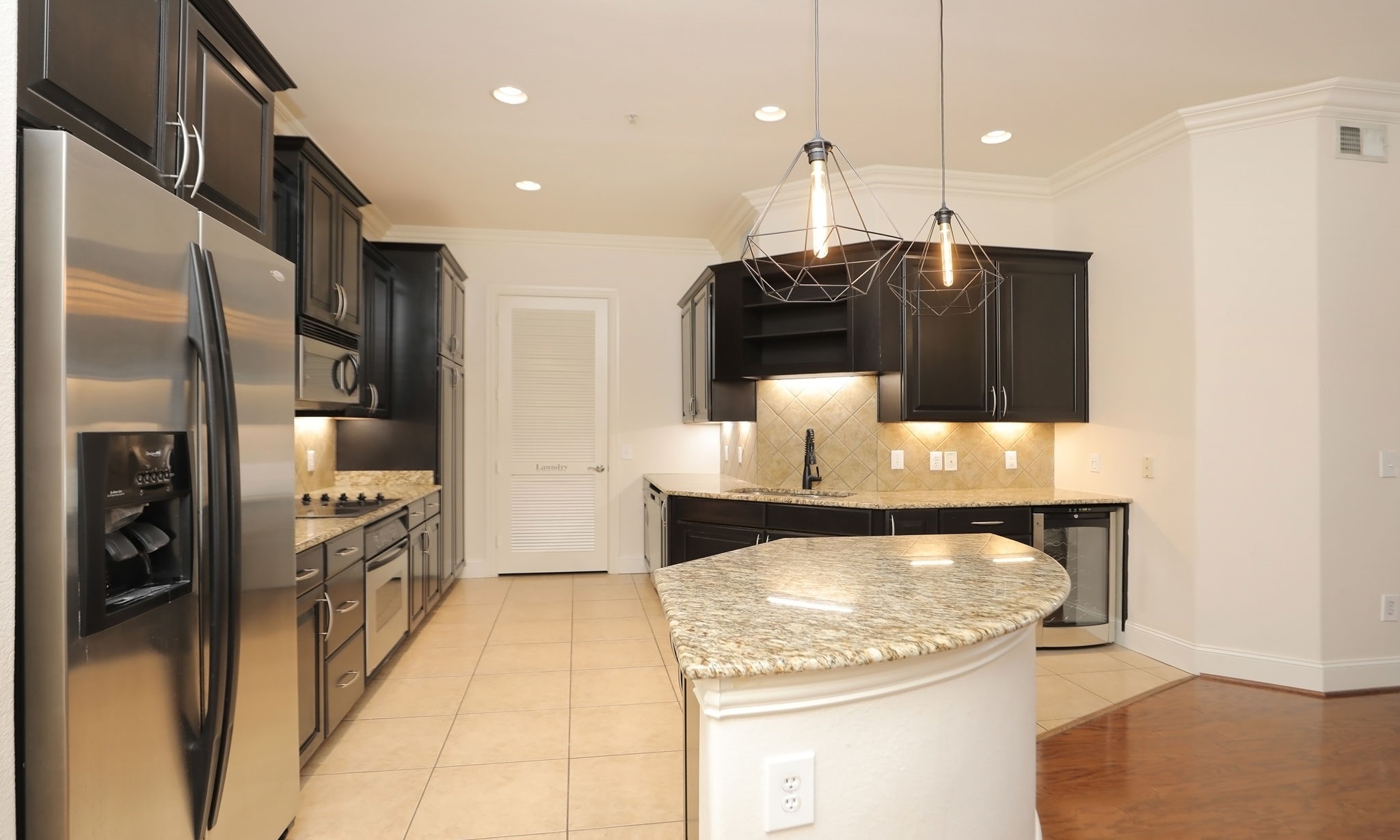 2120 Kipling Street, Unit 402 Houston, TX 77098 - Photo 9 of 30 a kitchen with stainless steel appliances granite countertop a refrigerator a stove and a sink