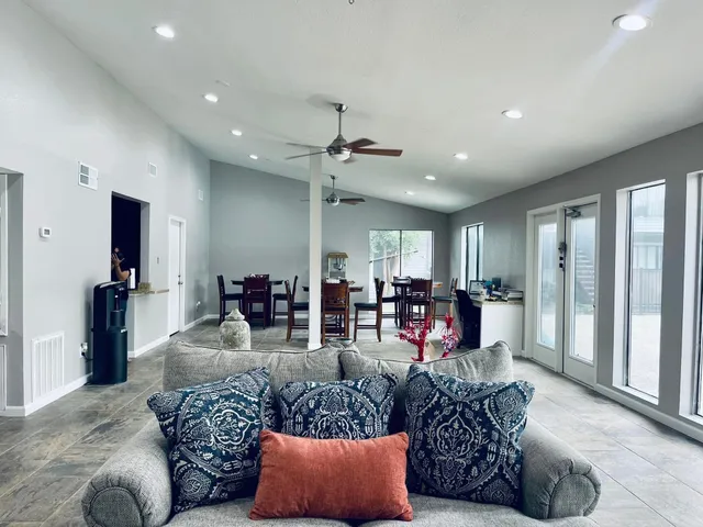 a living room with furniture and a large window