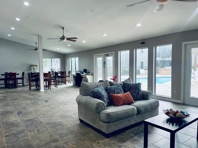 a living room with furniture and a large window