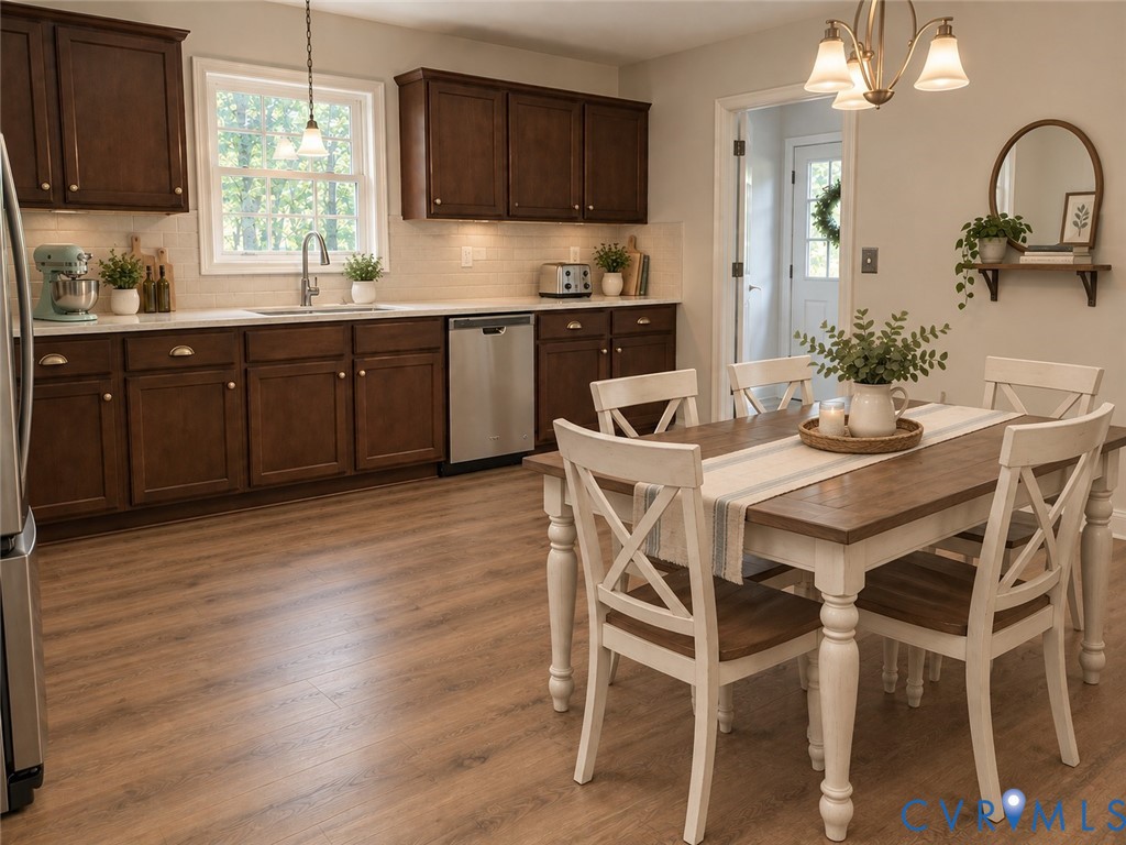 289 Winding Ridge Way Bumpass, VA 23024 - Photo 2 of 16 Kitchen featuring wood-finish flooring, dark wood