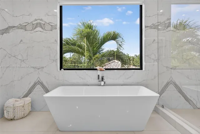 a bathroom with a shower and a sink