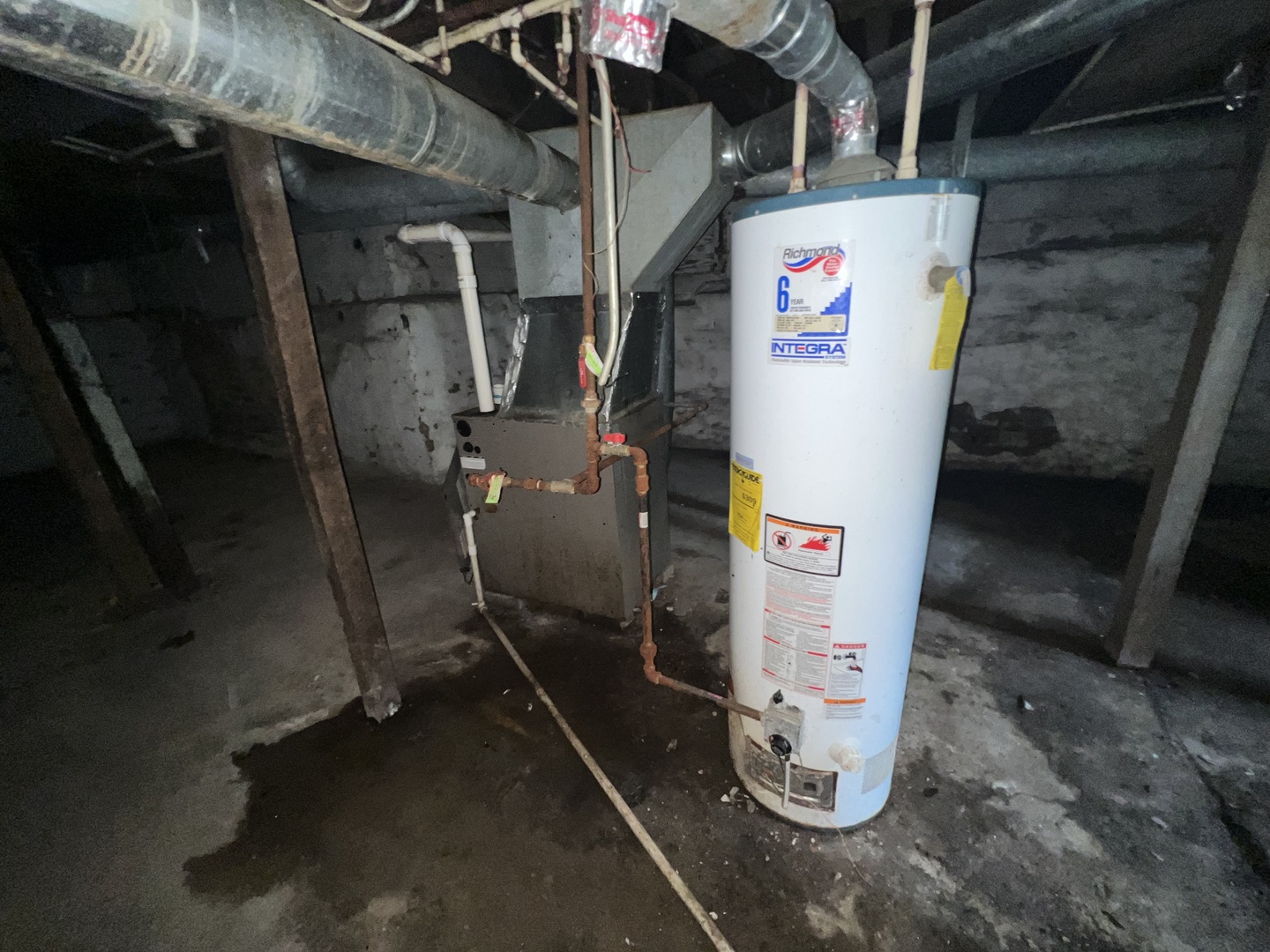 301 North West Avenue Kankakee, IL 60901 - Photo 12 of 13 a utility room with water heater refrigerator