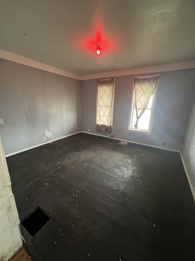 301 North West Avenue Kankakee, IL 60901 - Photo 4 of 13 a view of an empty room with a window