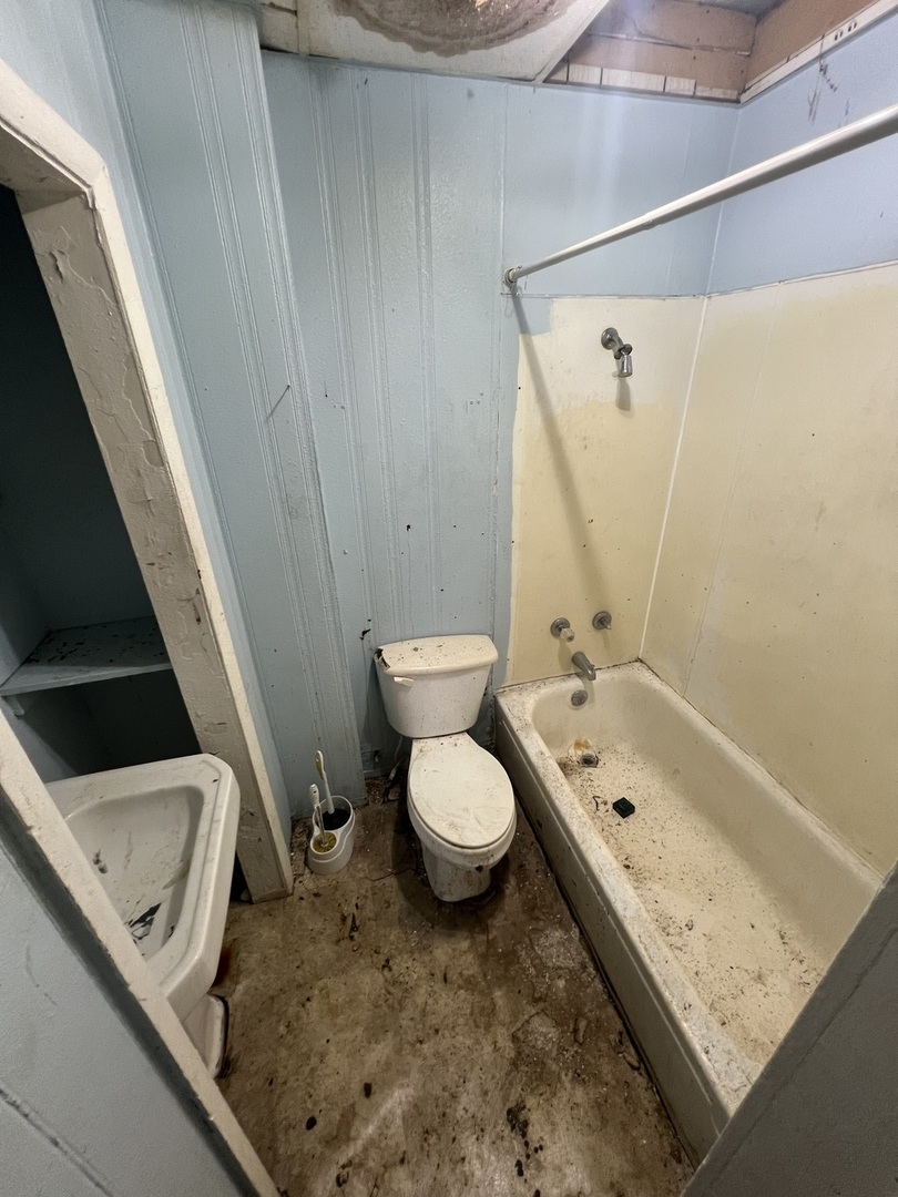 301 North West Avenue Kankakee, IL 60901 - Photo 10 of 13 a bathroom with a granite countertop sink toilet and shower