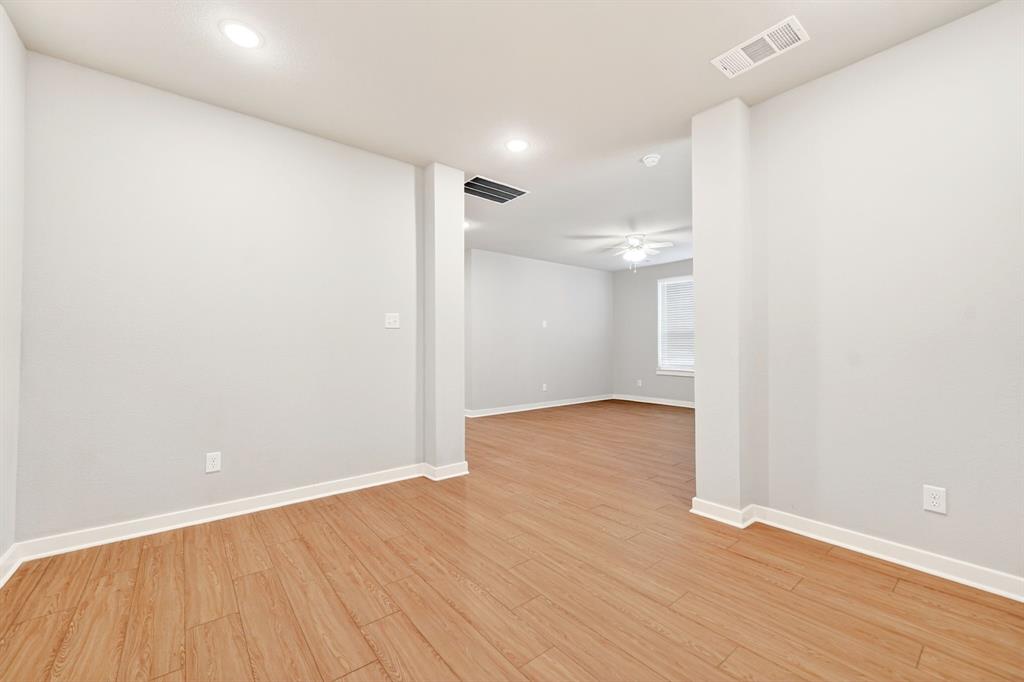 1810 Rhea Court Celina, TX 75009 - Photo 15 of 32 Living area featuring wood-look flooring, recessed lighting, and white baseboards