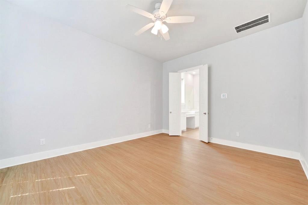 1810 Rhea Court Celina, TX 75009 - Photo 7 of 32 Spacious room featuring light-toned hardwood flooring, light grey walls, and a ceiling fan