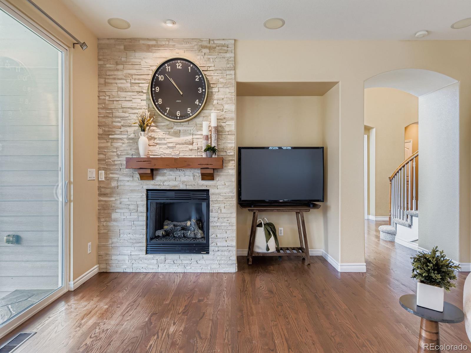 11074 Grayledge Circle Highlands Ranch, CO 80130 - Photo 11 of 47 a living room with furniture and a fireplace