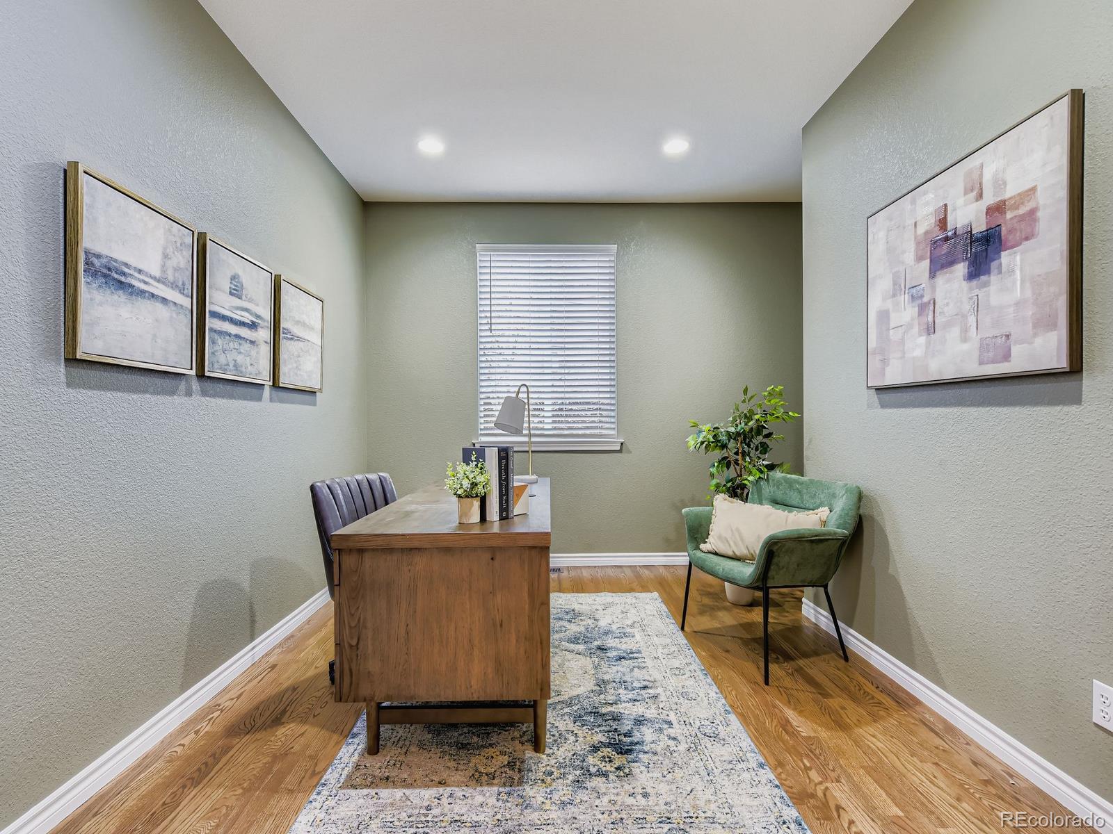 11074 Grayledge Circle Highlands Ranch, CO 80130 - Photo 12 of 47 a living room with furniture and wooden floor