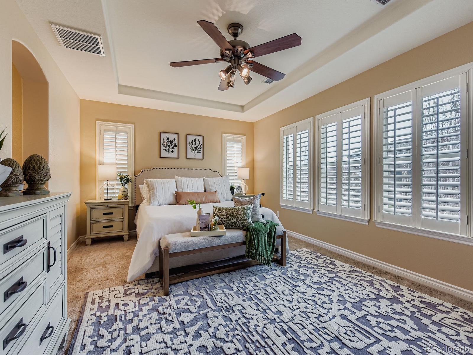 11074 Grayledge Circle Highlands Ranch, CO 80130 - Photo 20 of 47 a bed room with a bed and a couch