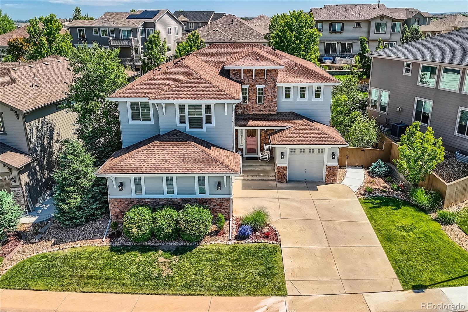 11074 Grayledge Circle Highlands Ranch, CO 80130 - Photo 2 of 47 a front view of a residential houses with yard