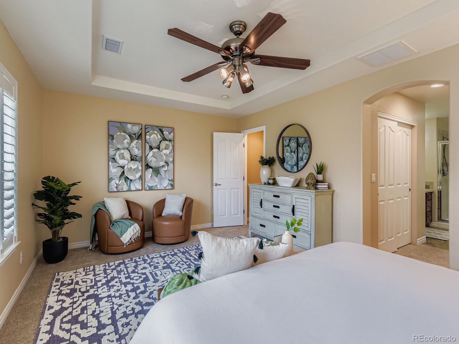 11074 Grayledge Circle Highlands Ranch, CO 80130 - Photo 21 of 47 a bedroom with furniture and a chandelier