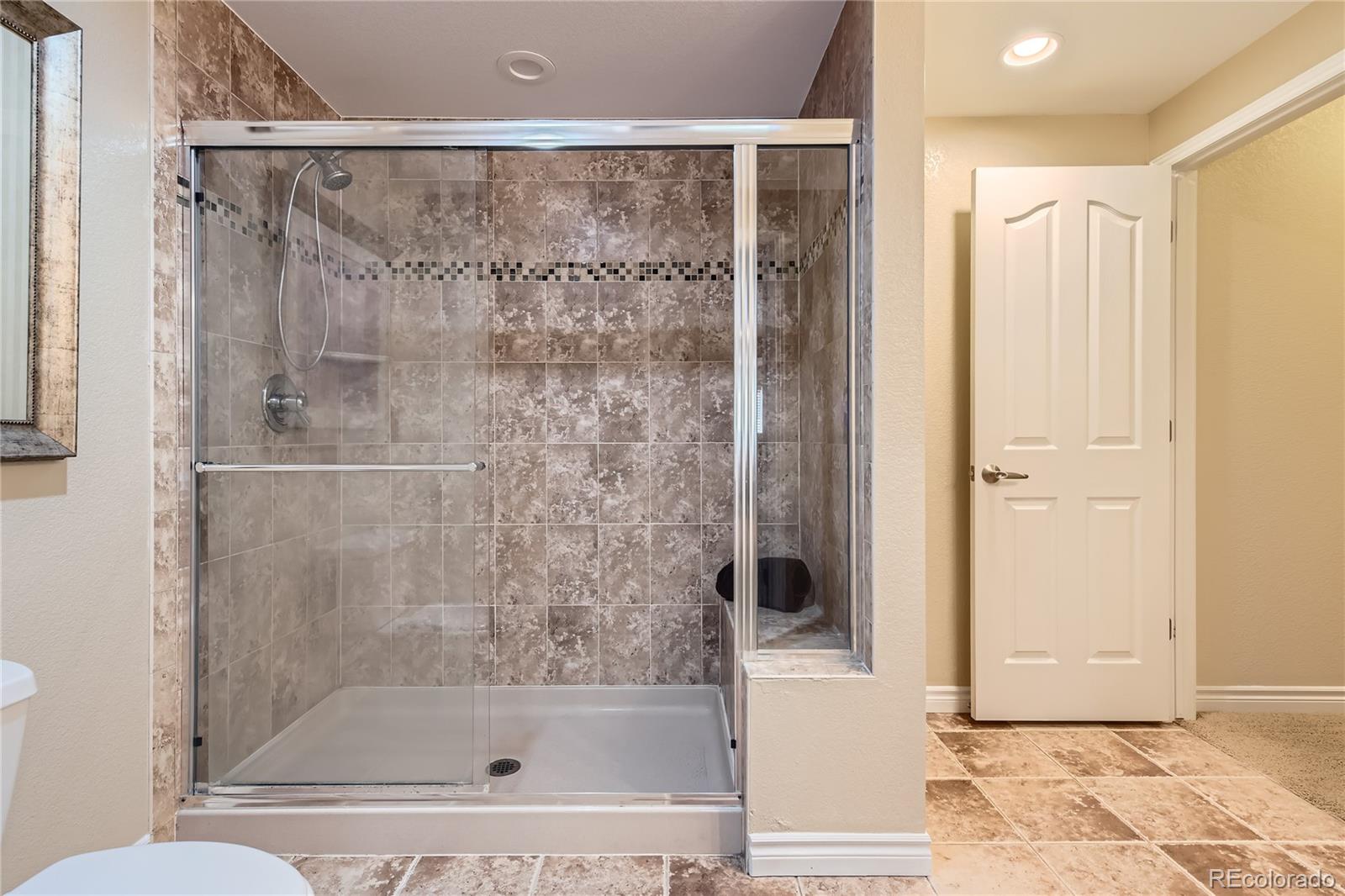 11074 Grayledge Circle Highlands Ranch, CO 80130 - Photo 35 of 47 a bathroom with a bathtub