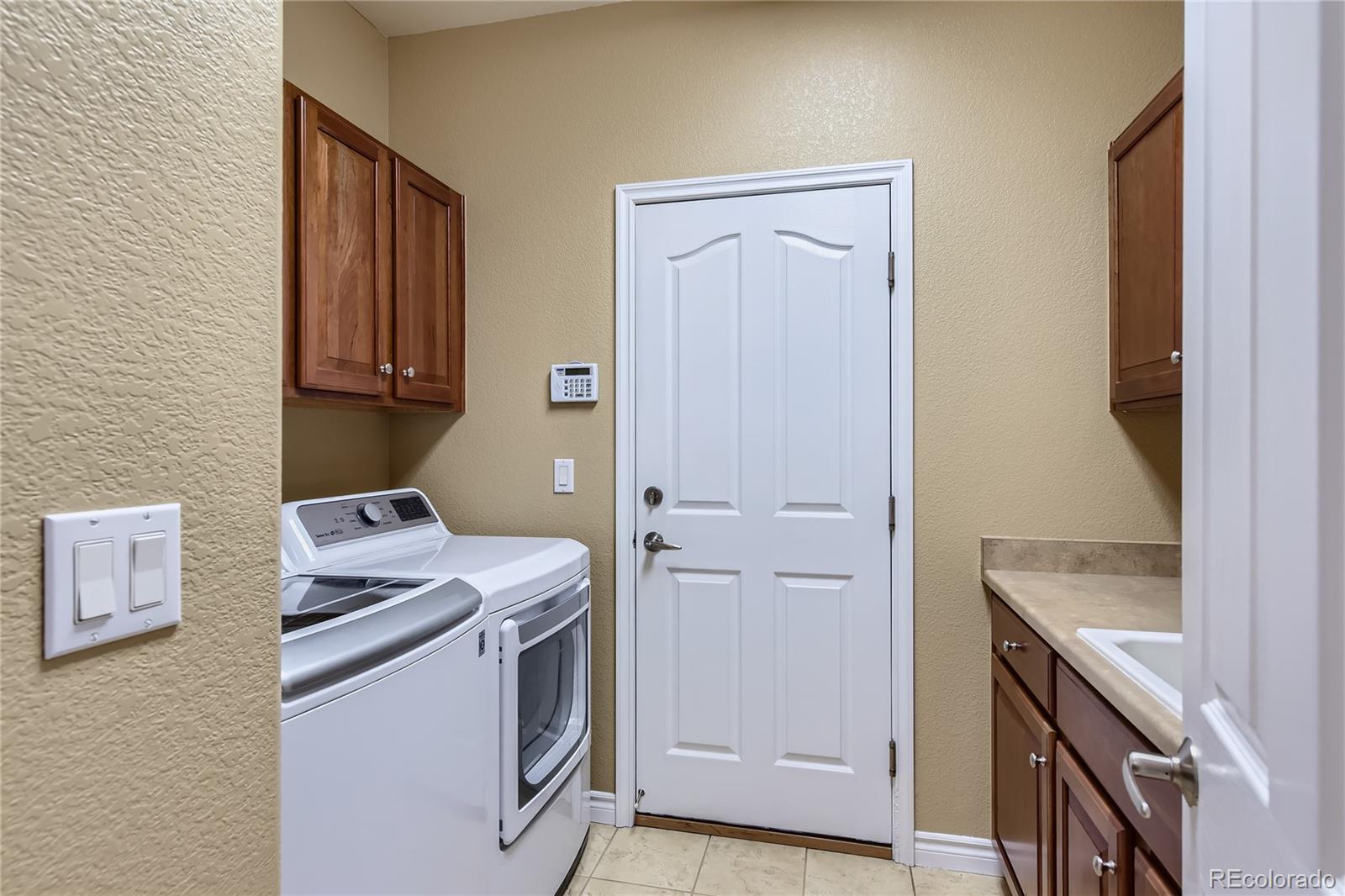 11074 Grayledge Circle Highlands Ranch, CO 80130 - Photo 36 of 47 a utility room with dryer and washer