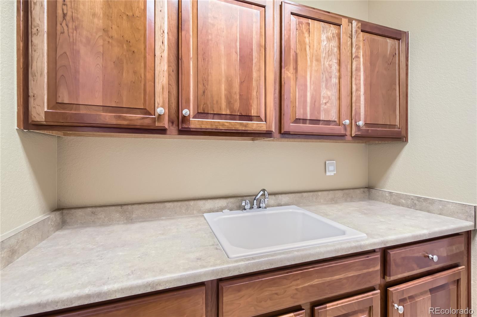 11074 Grayledge Circle Highlands Ranch, CO 80130 - Photo 37 of 47 a sink with a window