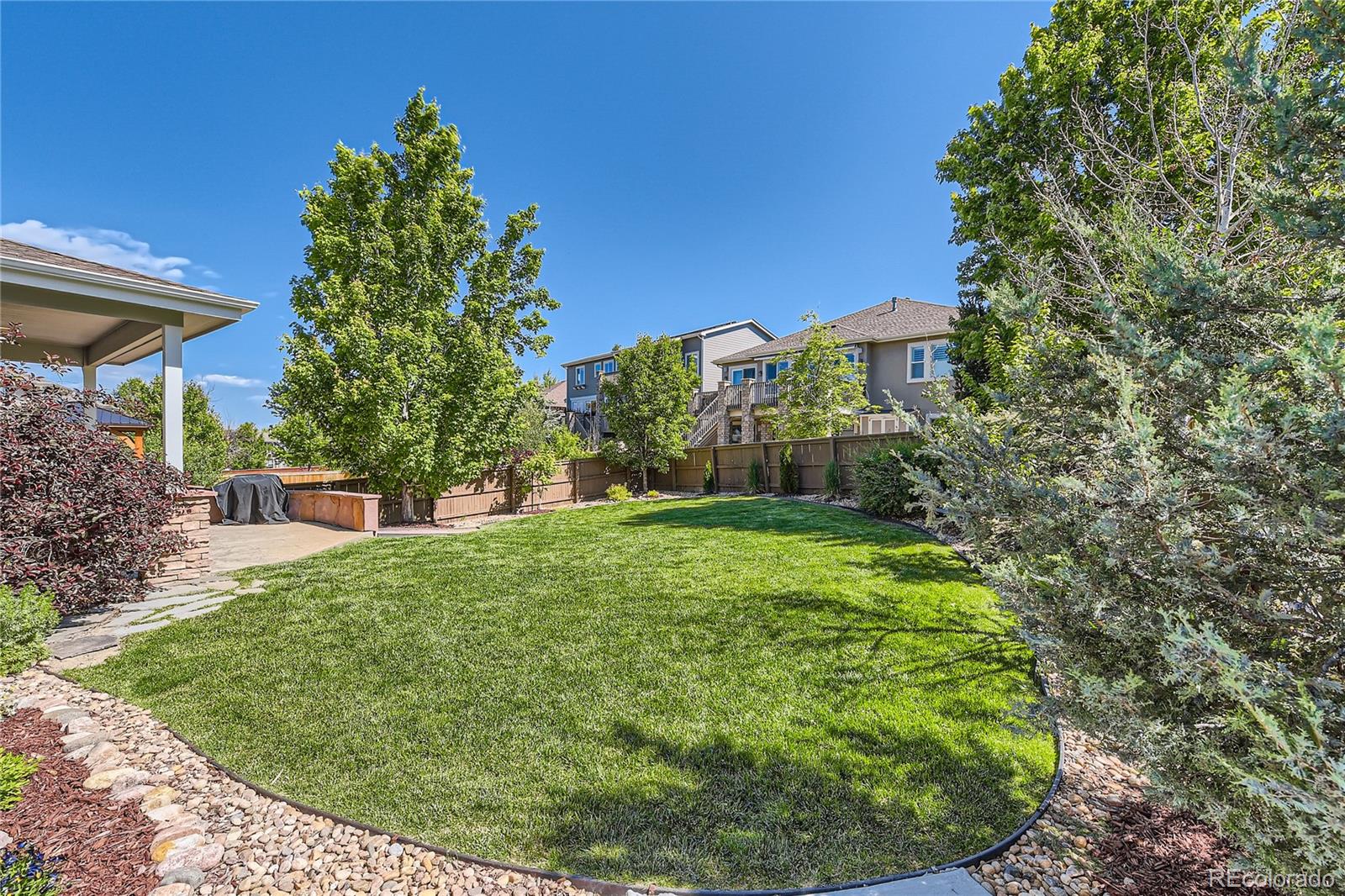 11074 Grayledge Circle Highlands Ranch, CO 80130 - Photo 40 of 47 a view of a backyard with plants