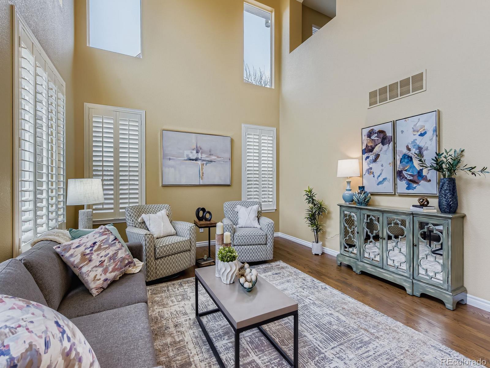11074 Grayledge Circle Highlands Ranch, CO 80130 - Photo 4 of 47 a living room with furniture and a wooden floor