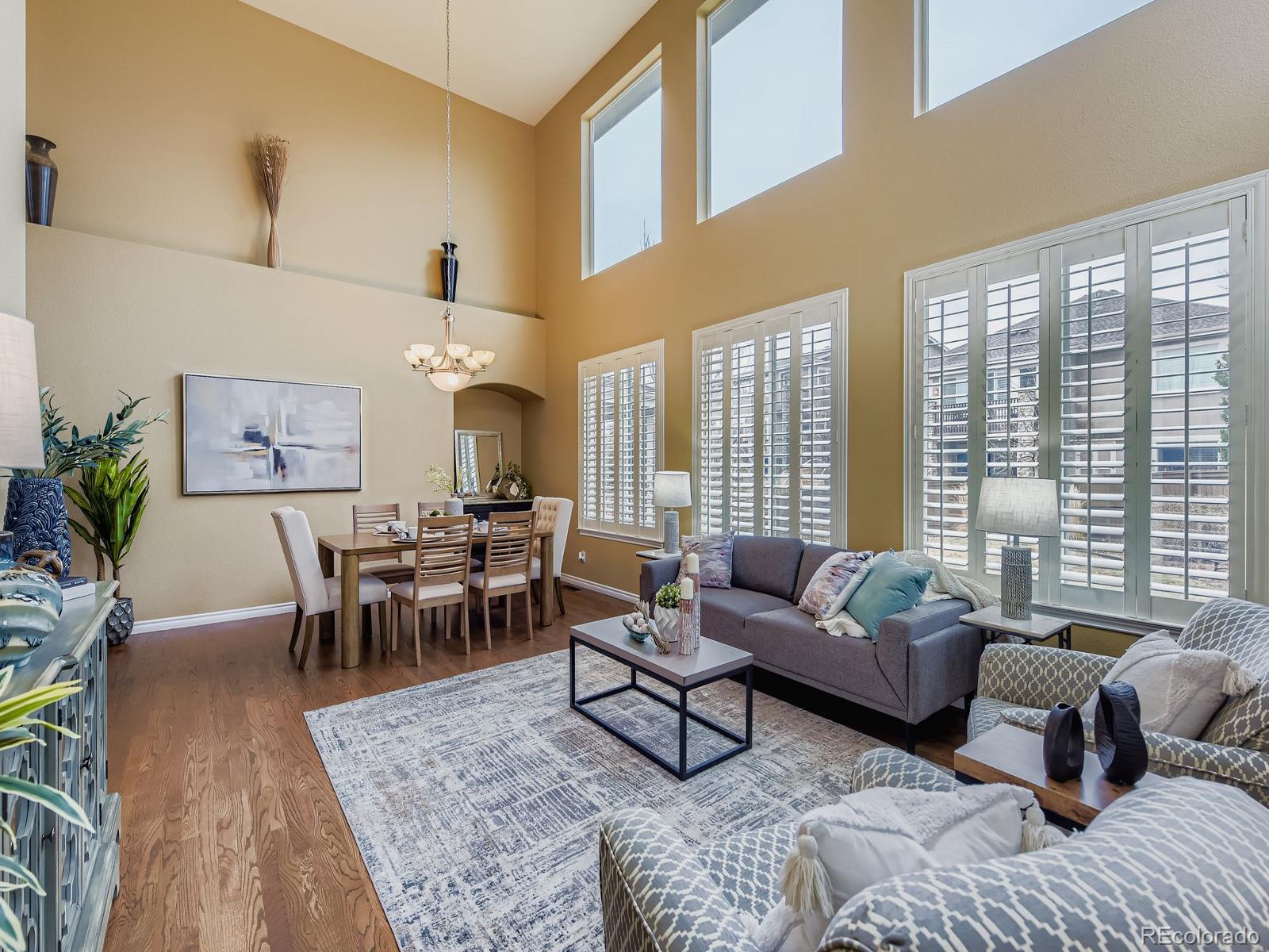 11074 Grayledge Circle Highlands Ranch, CO 80130 - Photo 5 of 47 a living room with furniture wooden floor and a large window