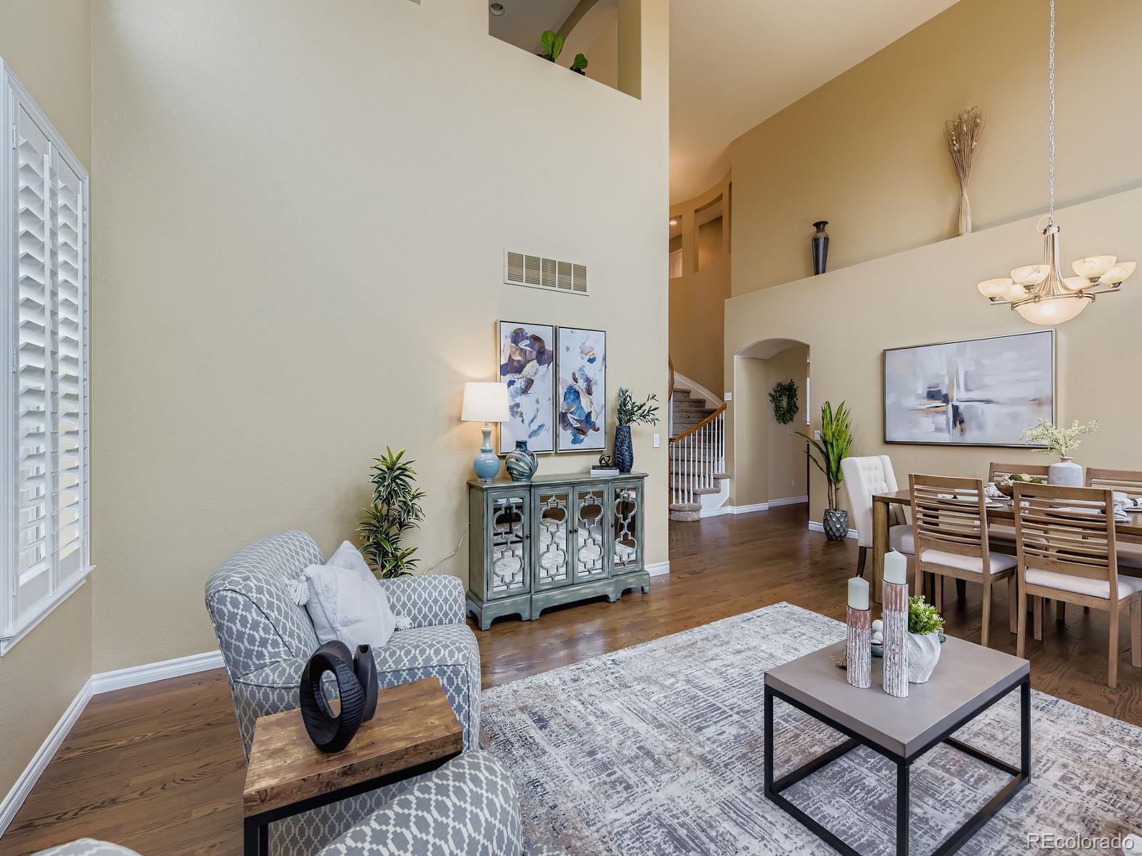 11074 Grayledge Circle Highlands Ranch, CO 80130 - Photo 7 of 47 a living room with furniture and wooden floor