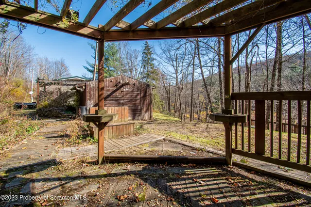 a view of a wooden roof deck