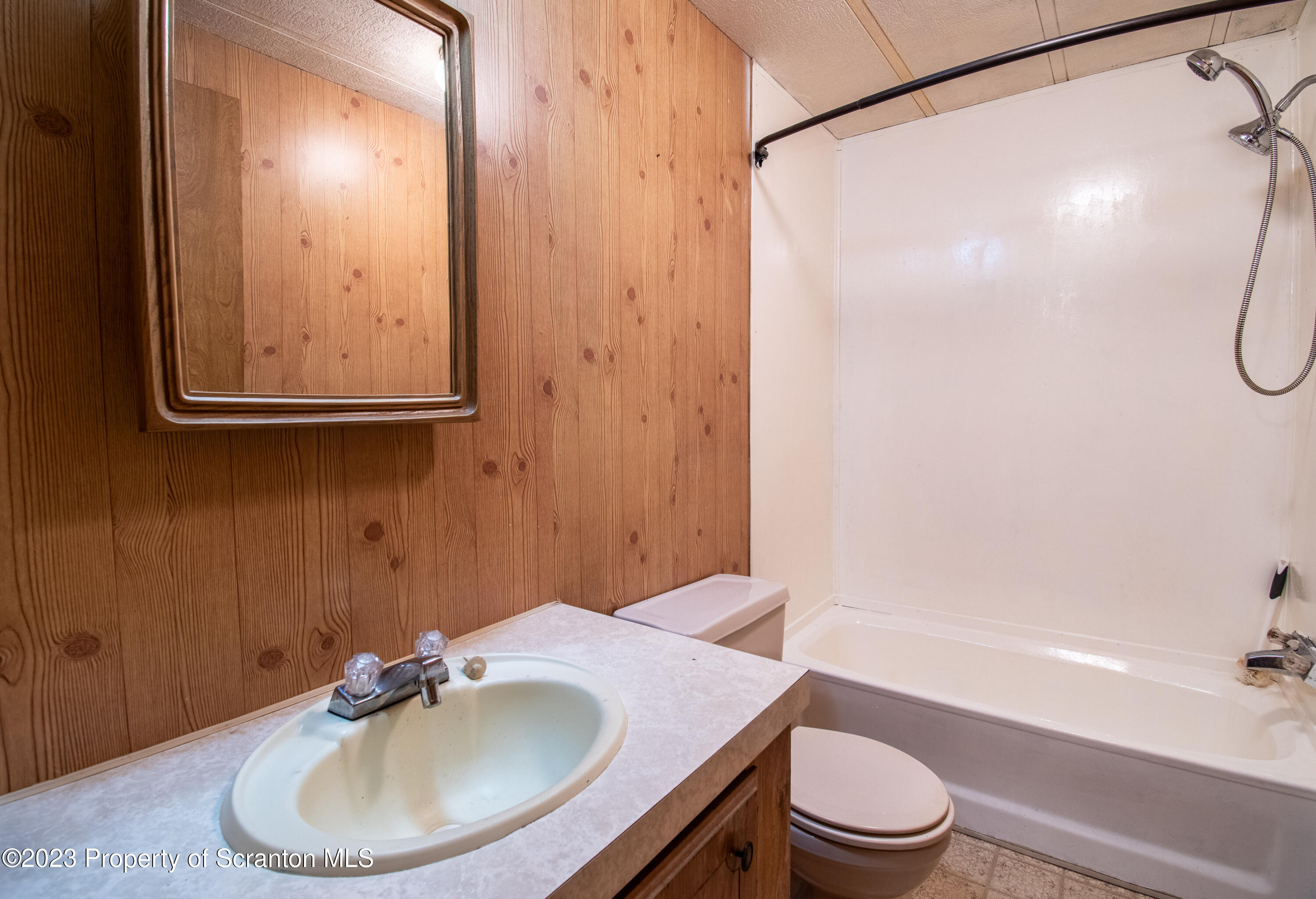 3489 Silver Creek Road Montrose, PA 18801 - Photo 22 of 35 a bathroom with a sink toilet and shower