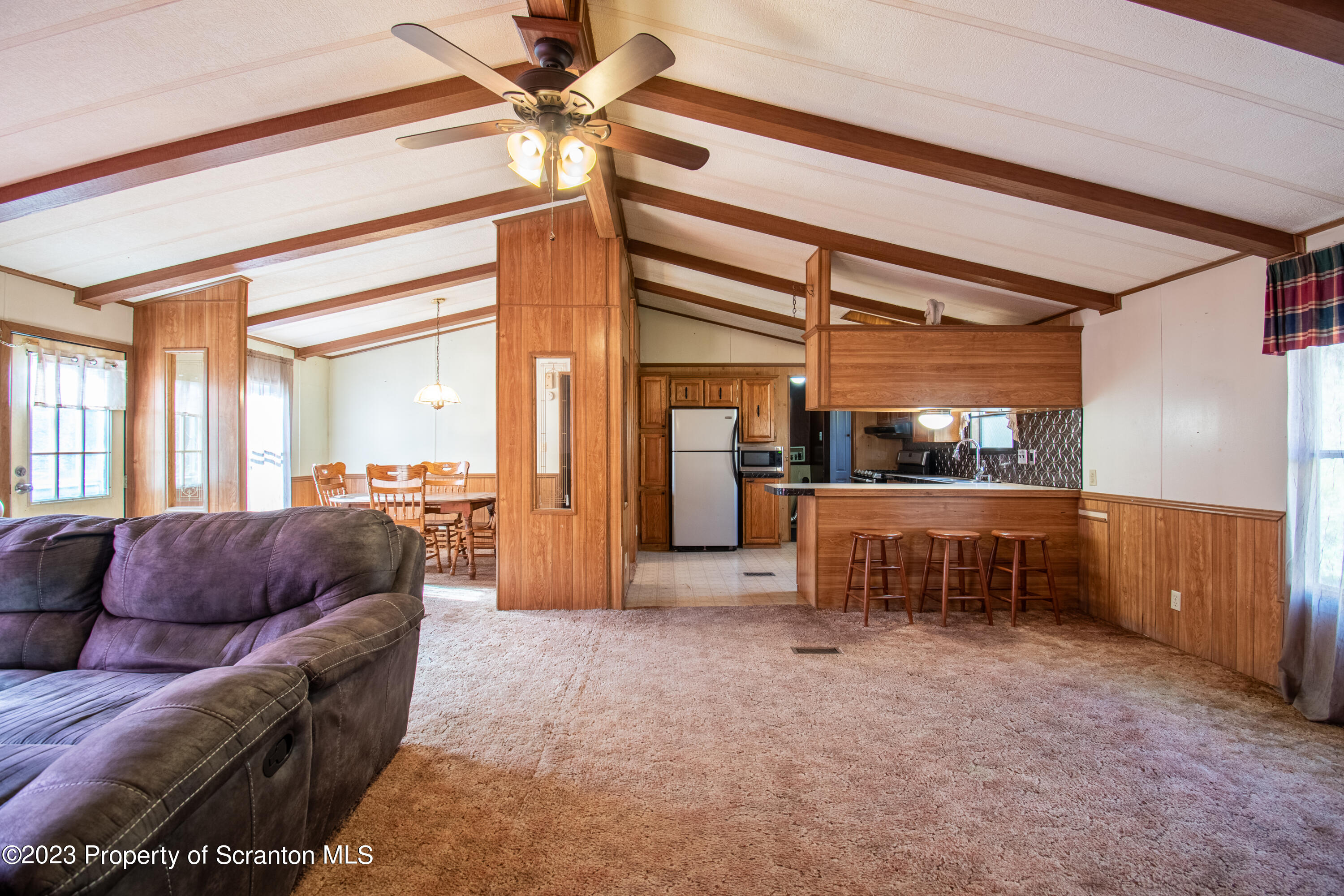 3489 Silver Creek Road Montrose, PA 18801 - Photo 23 of 35 a living room with furniture and a window