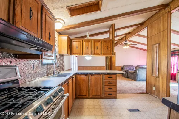 a view of kitchen and wooden floor