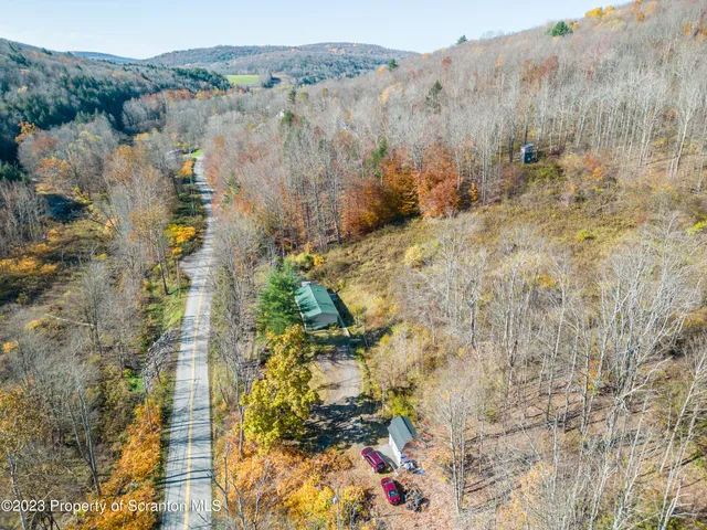 a view of house with a chairs in patio