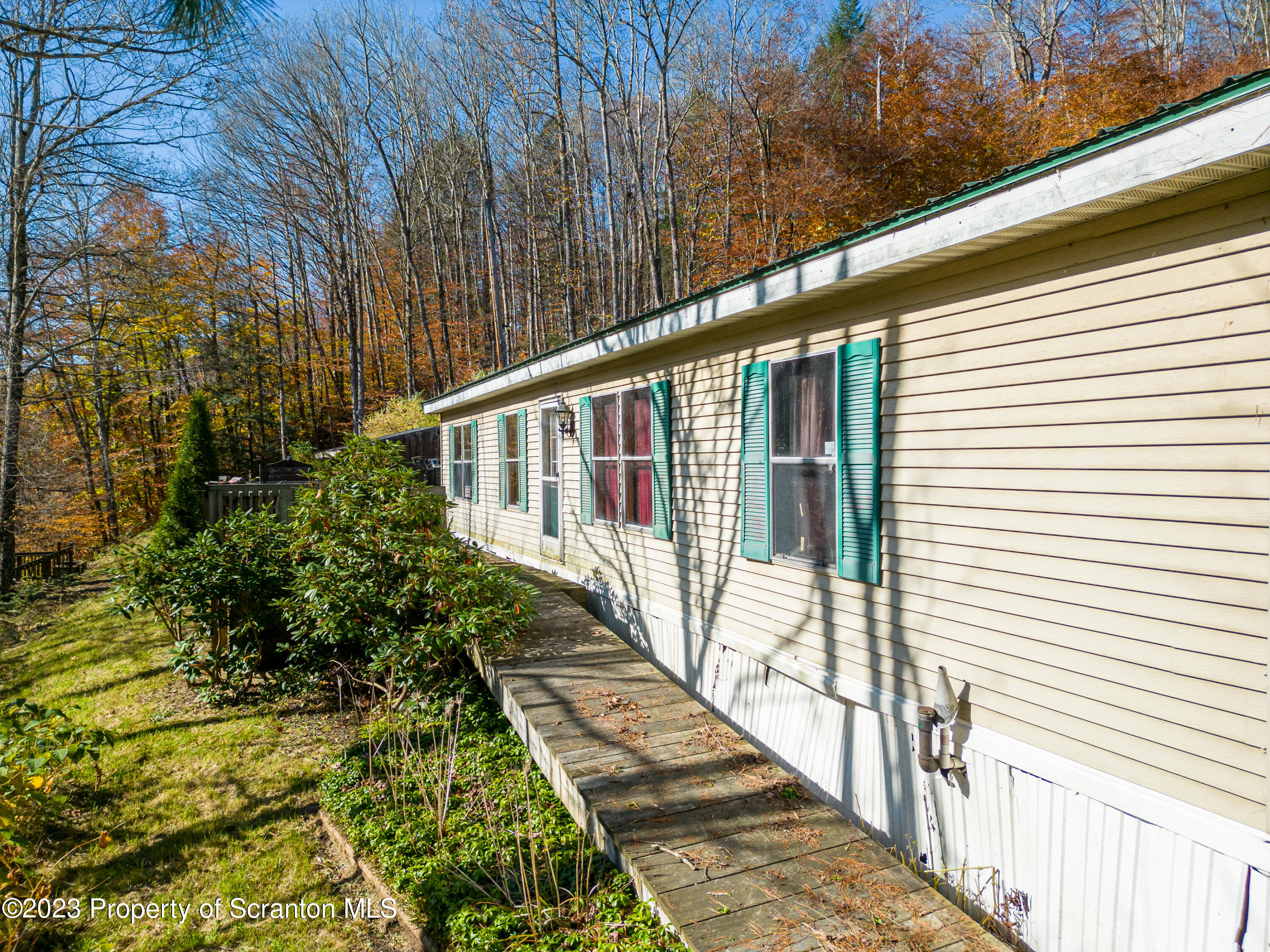 3489 Silver Creek Road Montrose, PA 18801 - Photo 7 of 35 a view of a balcony with wooden floor and fence