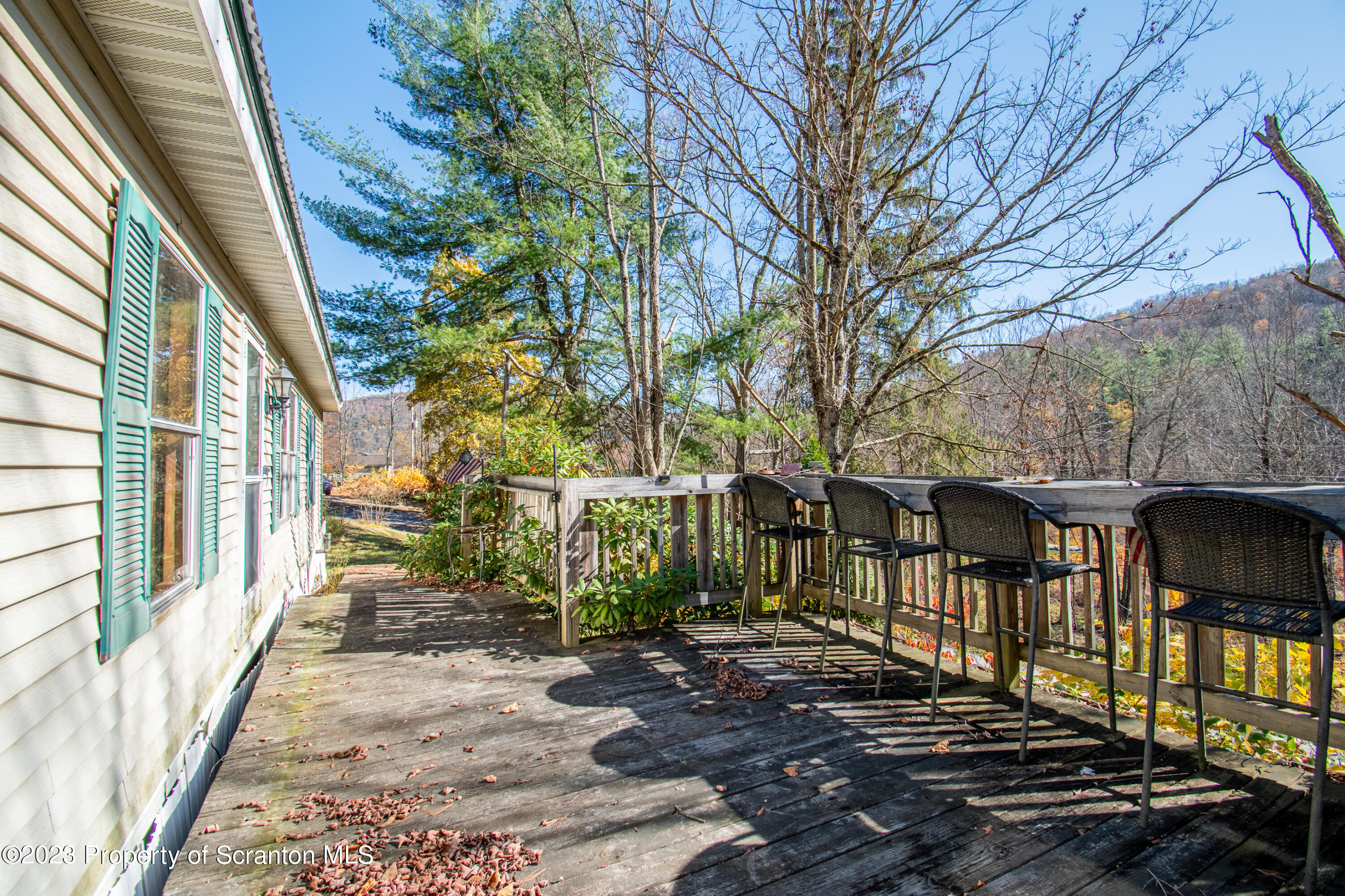 3489 Silver Creek Road Montrose, PA 18801 - Photo 8 of 35 a view of a patio with table and chairs and wooden fence