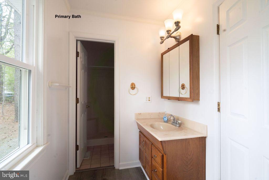 89 Club View Drive Lancaster, VA 22503 - Photo 12 of 25 a bathroom with a sink and a mirror