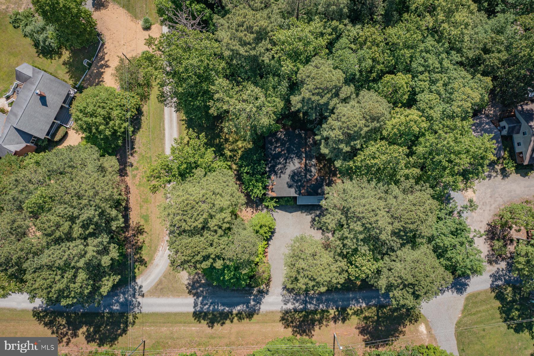 89 Club View Drive Lancaster, VA 22503 - Photo 19 of 25 an aerial view of residential house with outdoor space and trees all around