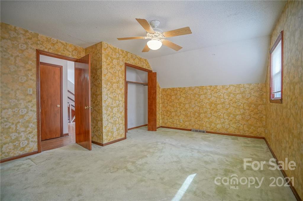 640 Coley Road Salisbury, NC 28146 - Photo 11 of 43 an empty room with closet and a ceiling fan