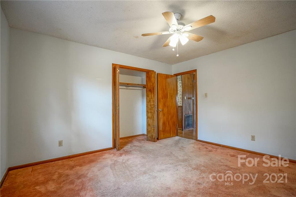640 Coley Road Salisbury, NC 28146 - Photo 18 of 43 an empty room with closet and a ceiling fan