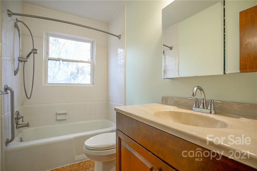 640 Coley Road Salisbury, NC 28146 - Photo 22 of 43 a bathroom with a granite countertop sink a toilet and shower