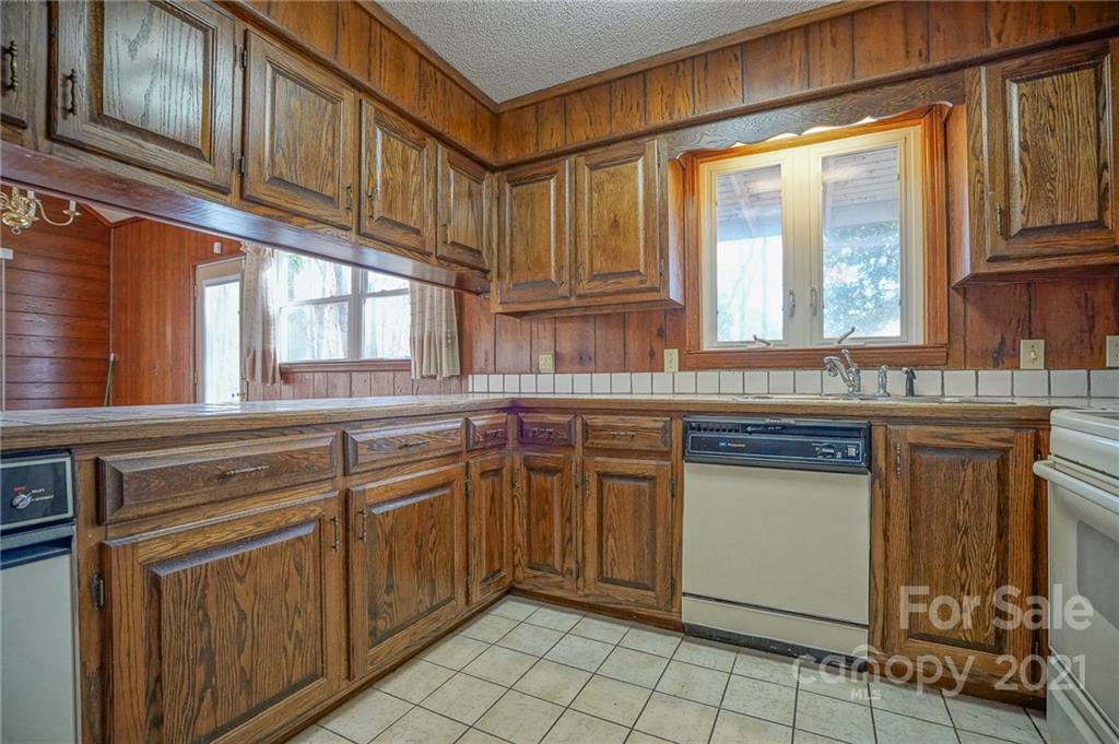 640 Coley Road Salisbury, NC 28146 - Photo 25 of 43 a kitchen with stainless steel appliances granite countertop a stove a sink and dishwasher
